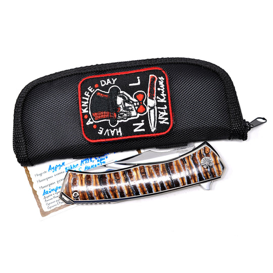 Zipper pouch and certificate are included with NL Knives Aurum Ultimate Custom M398 folding knife