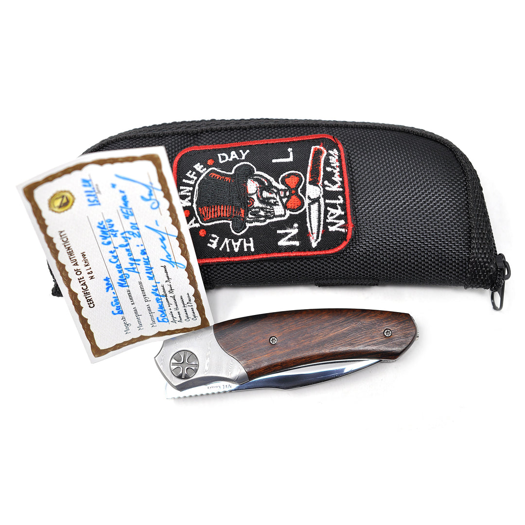 Zipper pouch and certificate are included with Baba Yaga MagnaCut Edition folding knife from NL Knives