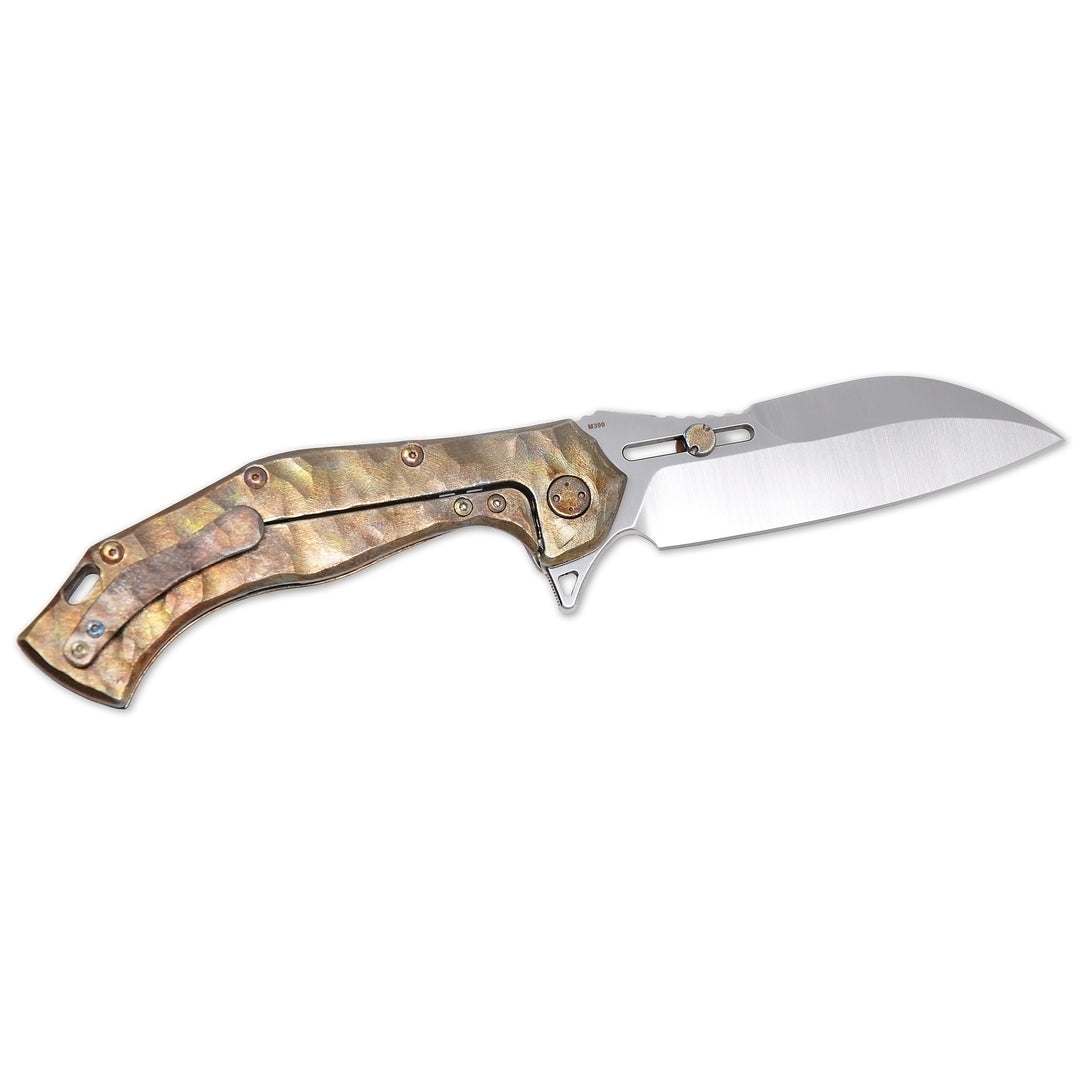 Olamic Soloist closed position showing M390 Scout blade spine and Neontropic titanium handle.