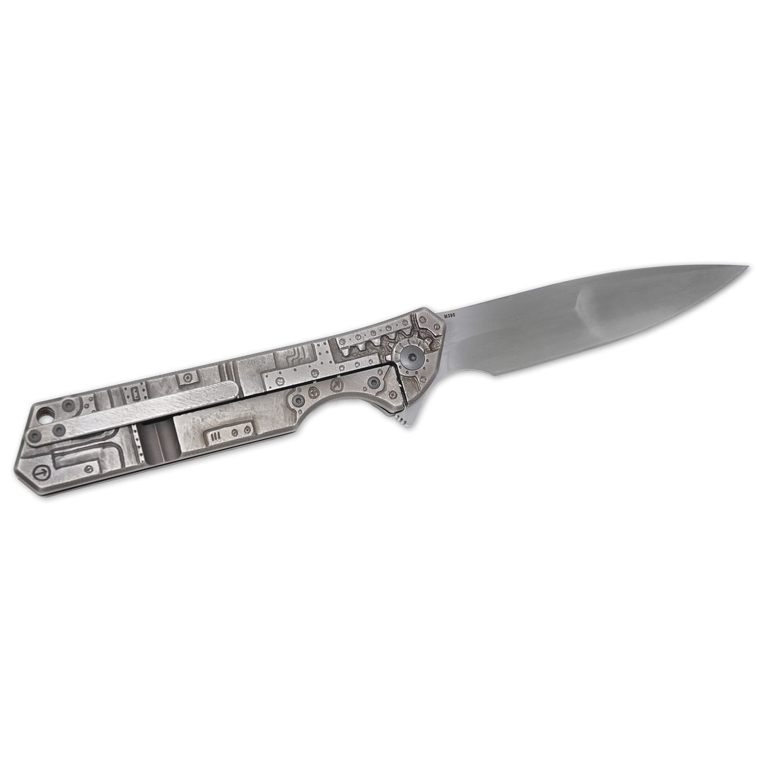 Olamic Rainmaker “Robot Skull” – Hand-Carved Titanium Art Knife (M390 Blade, Compound Grind by Mike Irie)