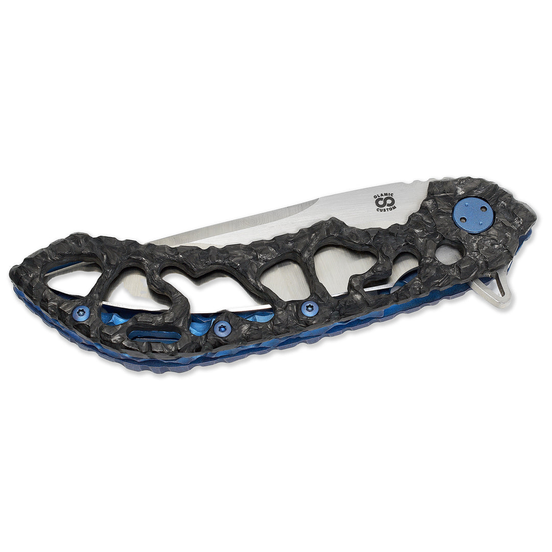 Closed Olamic Wayfarer 247 Featherweight with carbon fiber and blue titanium hybrid scales.