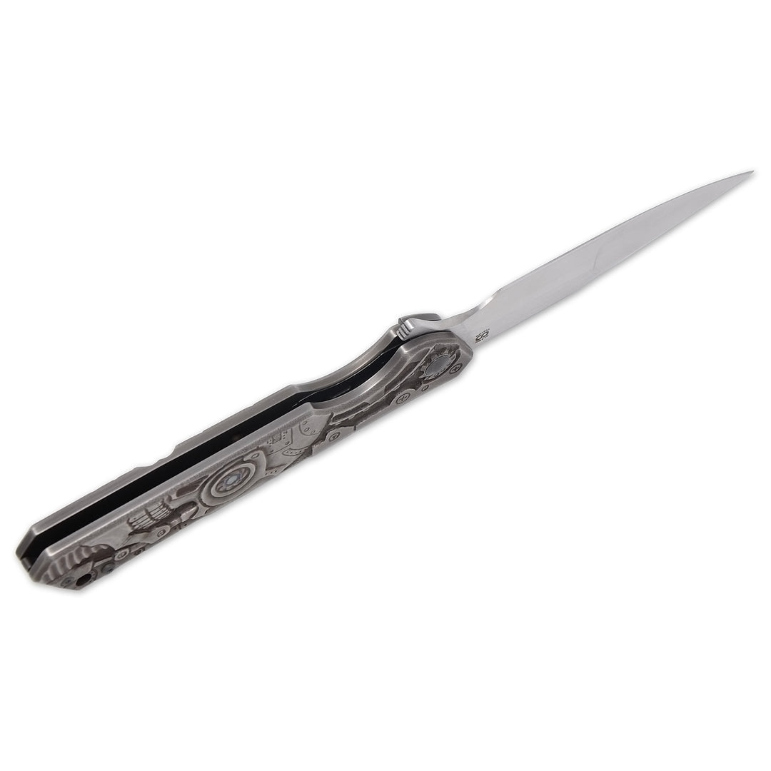 Olamic Rainmaker “Robot Skull” – Hand-Carved Titanium Art Knife (M390 Blade, Compound Grind by Mike Irie)
