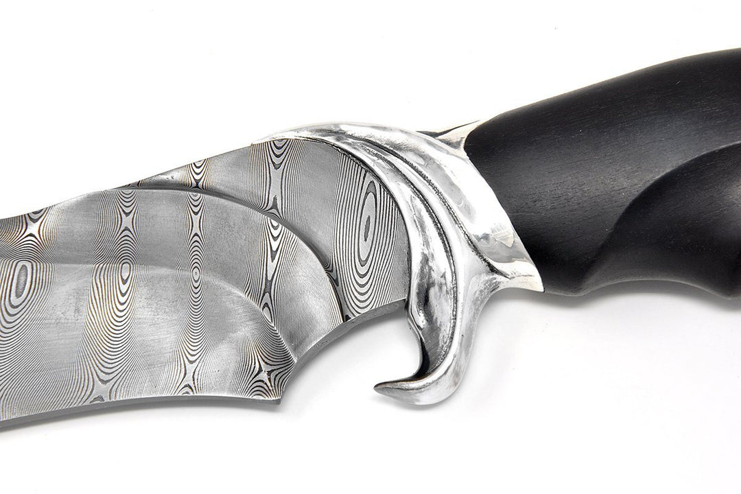 Guard on teh knife is made as Shark tail