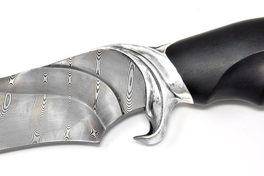 Guard on teh knife is made as Shark tail