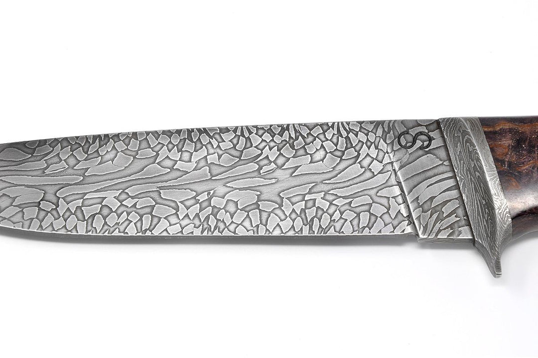 Knife has a beautiful Damascus pattern