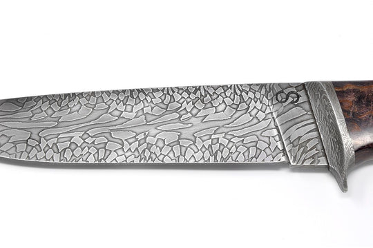 Knife has a beautiful Damascus pattern